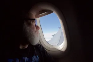 Gravity looks out plane window