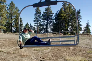 Spamalot sitting on a ski lift chair