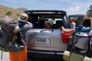 Climbing into shuttle driver's car at Walker Pass
