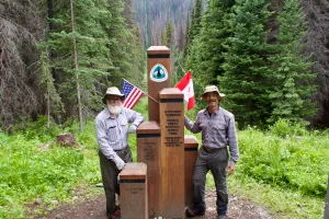 Gravity and Polecat standing at the northern terminus monument