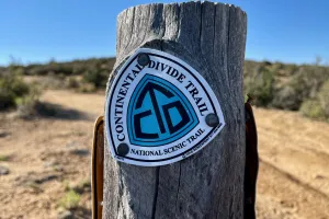A CDT sign nailed to a post