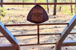 A rusty steel gate on the Arizona Trail
