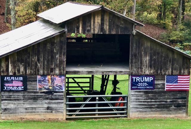 A barn with Trump banners