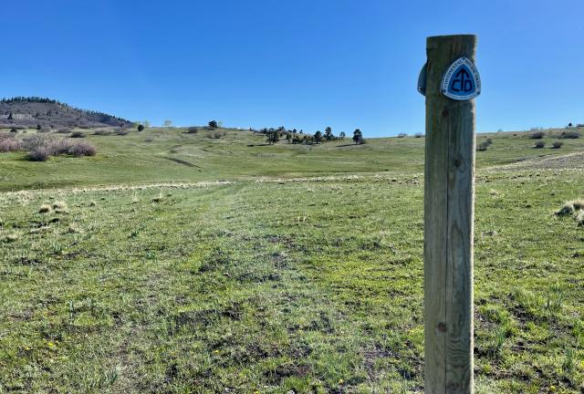 A marker identifies the path of the Continental Divide Trail