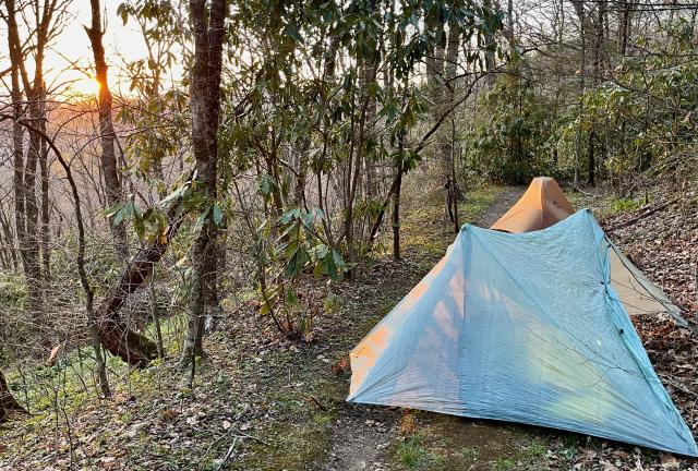 Two tents pitched on the trail