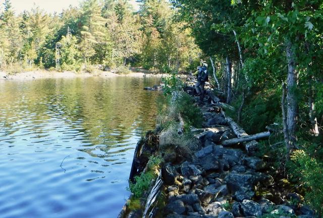 Stick walking on Pierce Pond Dam