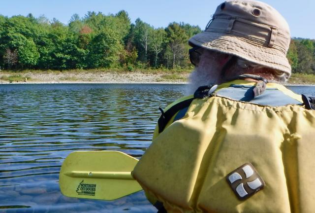Stick paddling across the Kennebec River
