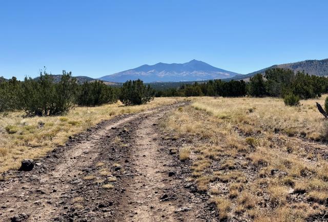 Humphreys Peak stands ahead at the horizon