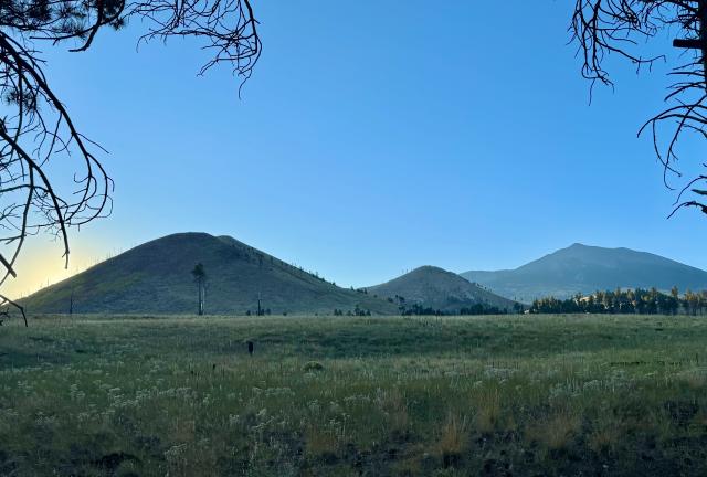 The sun sits low behind the White Horse Hills