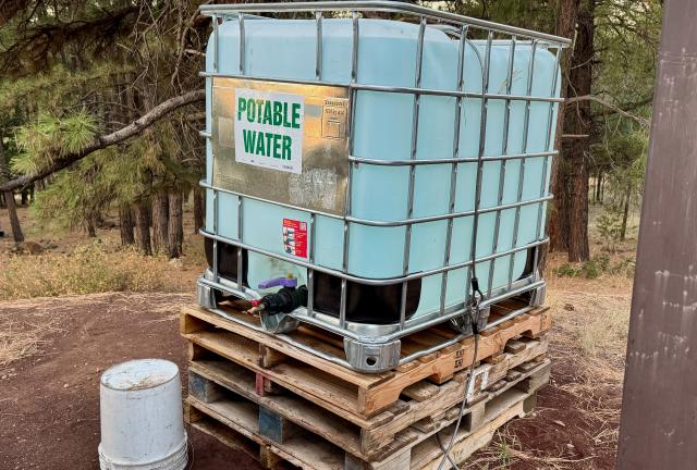 An Intermediate Bulk Container with water for campers