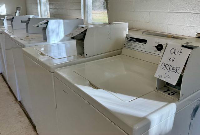 Washing machines with "out of order" signs