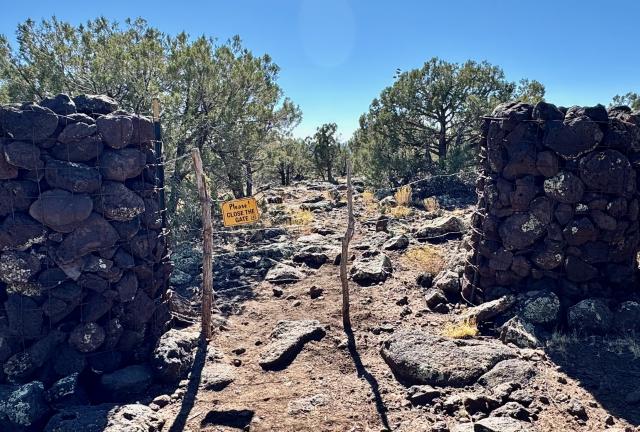 A gate made with stacked rocks
