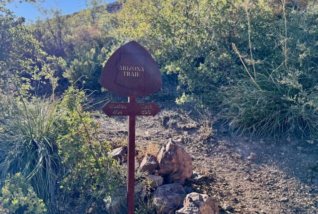 A sign marks the distance to Utah and Mexico
