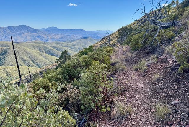 The trail goes around a mountain