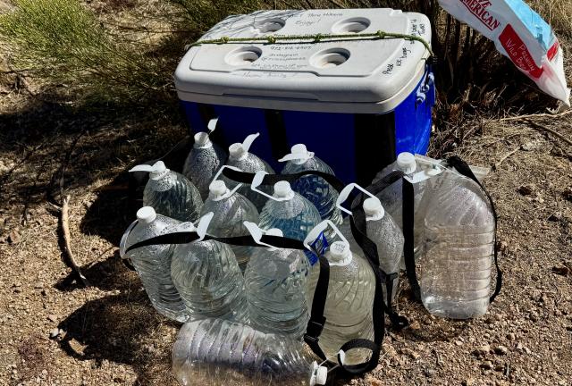 A cache of water left by trail angels