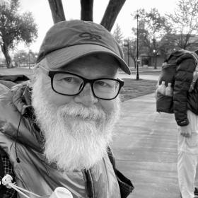 Gravity and Top O' wait for a bus in Alamosa