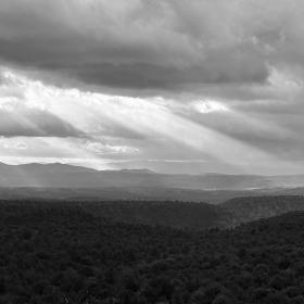 Sunlight streams through storm clouds
