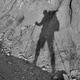 Gravity's shadow on the side of a rock slope