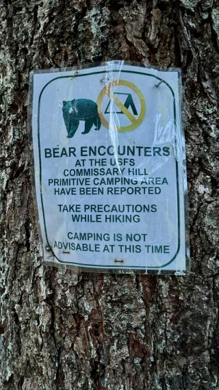A sign warns about bears near Commissary Hill